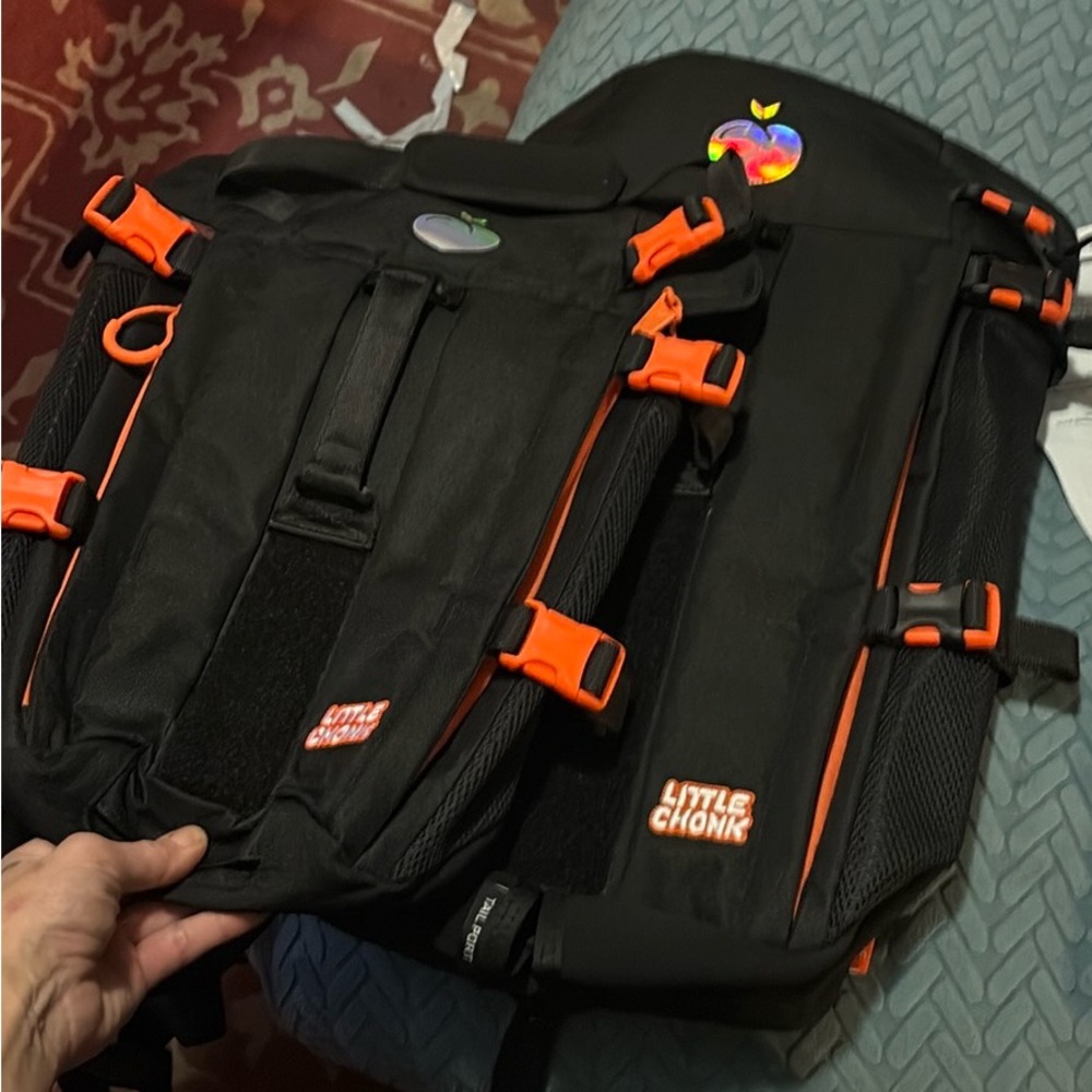 COPY - COPY - COPY - COPY - Small water proof  Black and Orange Backpack where …